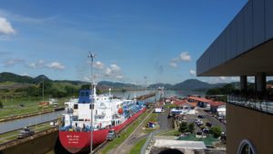 A commercial ship going through the locks of Panama Canal.