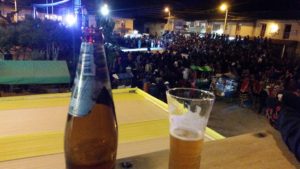 Having drinks while watching the festivities in Ollantaytambo, Peru.