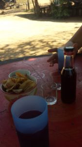 Enjoying our roselle jam, banana chips, and hibiscus wine. 